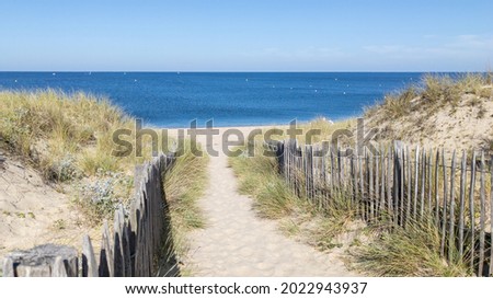 Coast access sandy sea patway fence to ocean beach atlantic coast panoramic at Cap-Ferret in France
