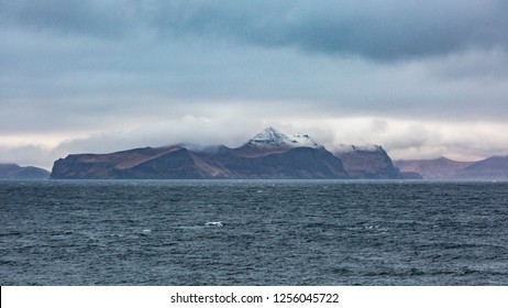 Coast of The Aleutian Islands. They are a chain of 14 large volcanic islands and 55 smaller ones belonging to both the U.S. state of Alaska and the Russian federal subject of Kamchatka Krai.