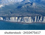 Coast of the Cook Inlet and the Chigmit Mountains in Alaska photographed from an airplane