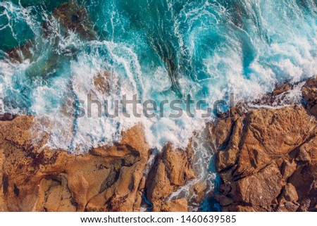 Coast of desert island with blue turquoise water beats on rocky reef Malta. Aerial top view