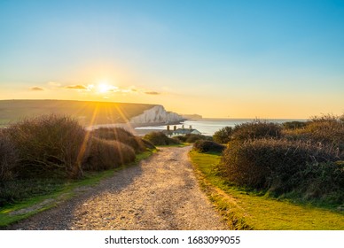 The Coast Guard Cottages And Seven Sisters Cliffs At Sunrise In Sussex, England, UK