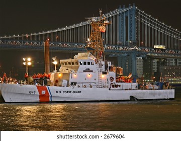 Coast Guard Cutter At Night With Bridge