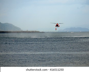 A Coast Guard Helicopter Practicing A Sea Rescue