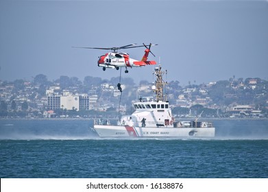 Coast Guard Jayhwak Helicopter Hovering Over Search And Rescue Boat