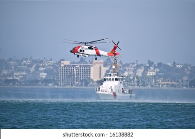 Coast Guard Jayhwak Helicopter Hovering Over Search And Rescue Boat