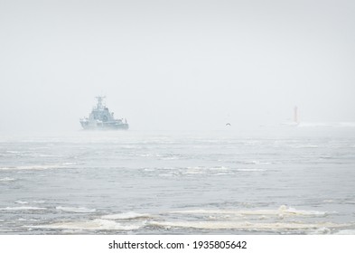 Coast Guard Ship Sailing During The Storm. Winter. Fog, Waves, Rough Weather. Baltic Sea. 