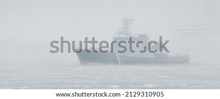 Coast guard ship sailing during the storm. Winter. Fog, waves, rough weather. Baltic sea. Transportation, nautical vessel, international security, global communications, border control, customs