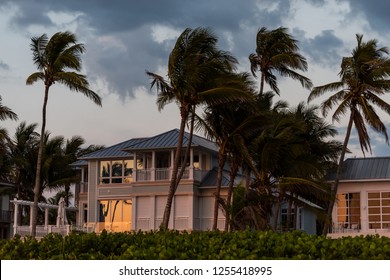 Coast House Beachfront Waterfront Vacation Home, House During Evening Sunset With Nobody In Florida, Gulf Of Mexico, Storm Weather And Wind Palm Trees