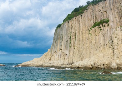 coast of Kunashir Island with columnar basalt cliff, Cape Stolbchaty - Shutterstock ID 2211894969