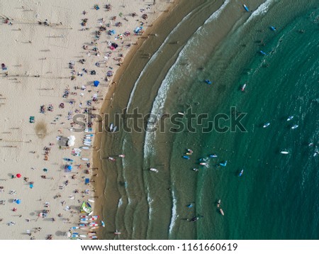 Similar – Aerial View From Flying Drone Of People Crowd Relaxing On Algarve Beach In Portugal