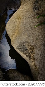 Coast Rock Stone Sculptor Art By Nature Looks Like A Lying Buddha Face By Erosion Of Water At Parangtritis Beach On Java, Indonesia