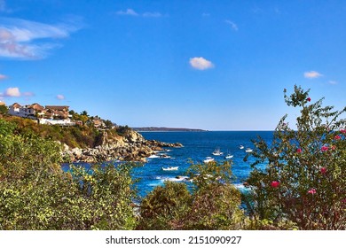 coast at sunny day with beautiful sea and ships in the ocean with blue sky in puerto escondido oaxaca 