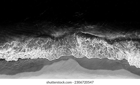 Coast with waves as a background from top view. Black white water background from drone. Summer seascape from air. Travel - image