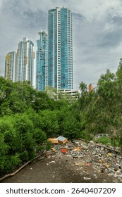 Coastal area filled with plastic waste and mangrove trees forest - stock photo