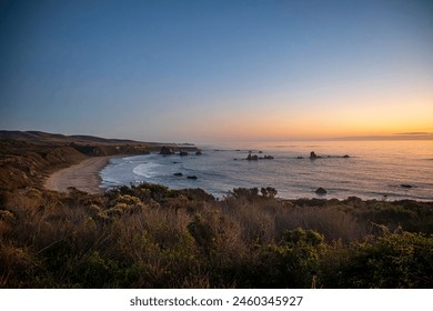 Coastal California, Big Sur, sunset, Pacific Ocean, coastal cliffs, rugged coastline, golden hour, breathtaking, scenic beauty, majestic, coastline, ocean views, dramatic, cliffs, waves crashing - Powered by Shutterstock