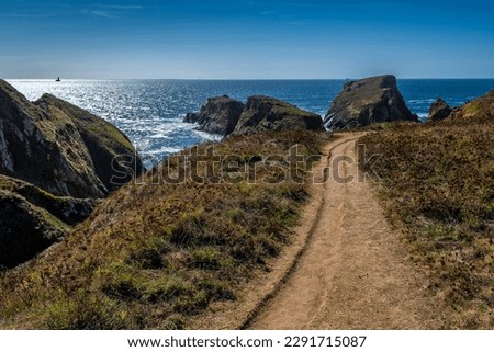Coastal Hiking Path With Spectacular Cliffs At Peninsula Pointe Du Van On Cap Sizun At The Finistere Atlantic Coast In Brittany, France