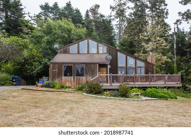 Coastal Home with Wraparound Deck and Redwood Siding