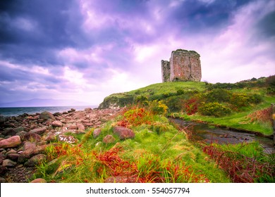 Coastal landscape along the Dingle Peninsula, County Kerry in Ireland with medieval castle ruins and dramatic sky.  - Shutterstock ID 554057794