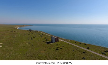 Coastal Landscape with Green Fields and Solitary Road on a Sunny Day - Powered by Shutterstock