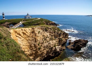 Coastal Landscape With The Lighthouse On Pancha Island. Ribadeo, Lugo, Galicia, Spain.