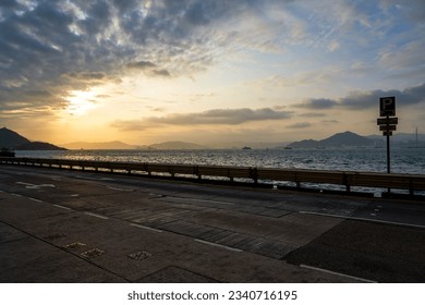 Coastal road and vehicles in Kennedy Town, Hong Kong - Powered by Shutterstock