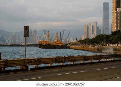 Coastal road and vehicles in Kennedy Town, Hong Kong - Powered by Shutterstock