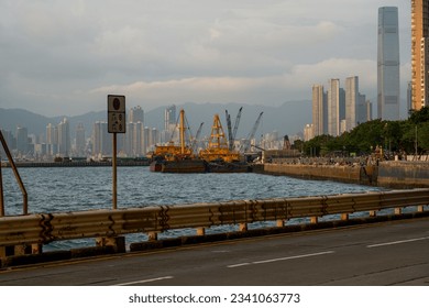 Coastal road and vehicles in Kennedy Town, Hong Kong - Powered by Shutterstock