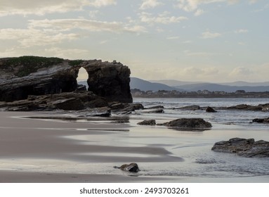 Coastal rock formation landscape at low tide, serene ocean scene with natural beauty. Cathedral Beach, Lugo, Spain - Powered by Shutterstock