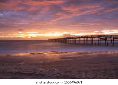 Coastal Sunrise Over The Atlantic Ocean And Fishing Pier In Avon, North Carolina.