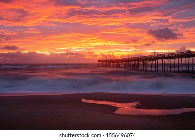 Coastal Sunrise Over The Atlantic Ocean And Fishing Pier In Avon, North Carolina.