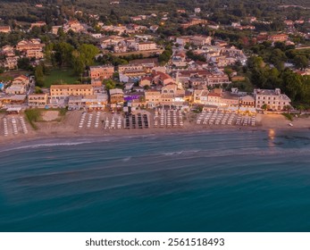 Coastal town at dusk with beach and ocean view - Powered by Shutterstock