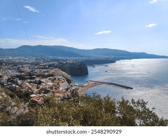 Coastal Town on Hillside with Dense Buildings, Prominent Cliff, and Pier by the Sea - Powered by Shutterstock