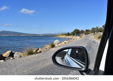 Coastal view from 2 angles. Inside mirror image of the car.
