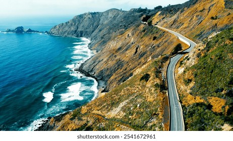 Coastal winding road along rugged cliffs. A dramatic aerial view of a winding coastal road hugging steep cliffs beside a turquoise ocean. - Powered by Shutterstock