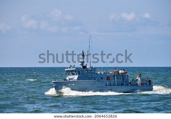 Coastguard, rescue and support patrol boat for\
defense sailing in blue sea. Navy patrol vessel protecting water\
borders and fisheries. Military ship, warship, battleship. Baltic\
Fleet, Russian Navy