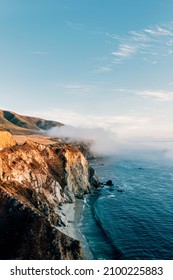 The Coastline Of Big Sur At Sunset During A Road Trip Across The USA.