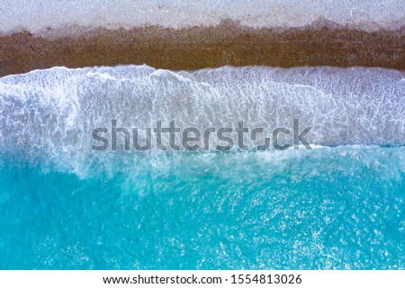 Similar – Aerial Panoramic Drone View Of Blue Ocean Waves Crushing On Sandy Beach in Portugal