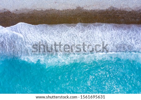 Similar – Aerial Panoramic Drone View Of Blue Ocean Waves Crushing On Sandy Beach in Portugal