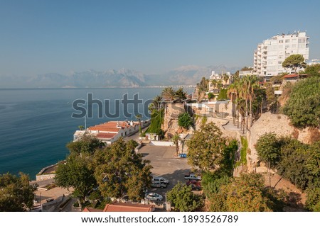 Coastline with the city Antalya and blue sea and the coast with hotels farway