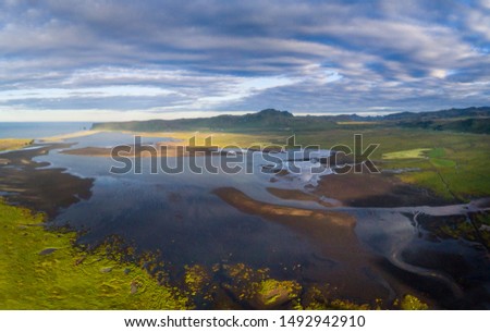 Similar – Image, Stock Photo Troll rock in Iceland stands in the sea