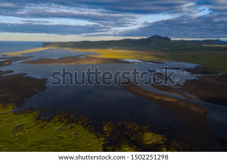 Similar – Image, Stock Photo Troll rock in Iceland stands in the sea