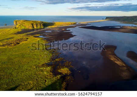 Similar – Image, Stock Photo Troll rock in Iceland stands in the sea