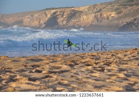 
Coastline in Parque Natural do Sudoeste Alentejano e Costa Vicentina, Algarve, Portugal in October, big, splashing waves and orange and yellow cliffs