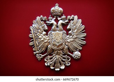 Coat Of Arms Of Austrian Empire On Red Background