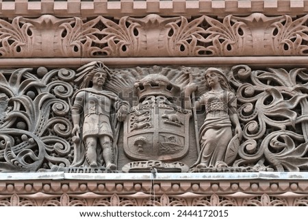 Coat of arms.Colonial architectural feature or detail in Old City Hall Building (1898), Toronto, Canada