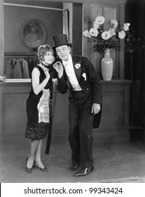 Coat Clerk Whispering To A Man In A Top Hat