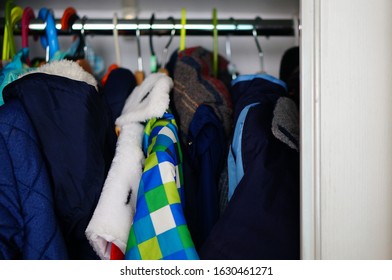 A Coat Hanger Pole With Different Color  Coats