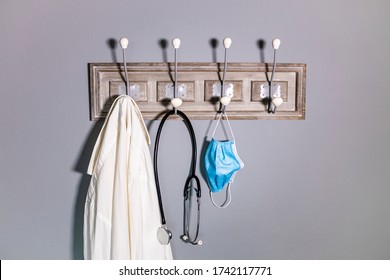 Coat Rack Of A Doctor With A Medical Mask