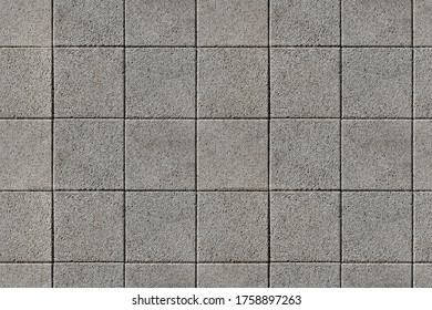 Coating with modern textured paving tiles of square shape. - Powered by Shutterstock