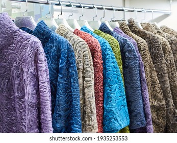 Coats of dyed fur goat and sheep in textile shop